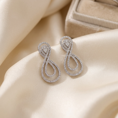 Pear shape diamond swirl earrings - detail view