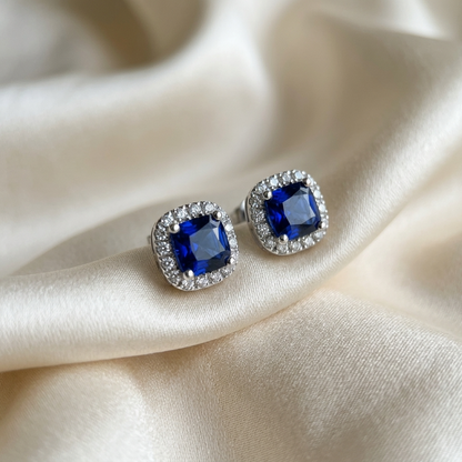 Sapphire and diamond halo earrings - angled view