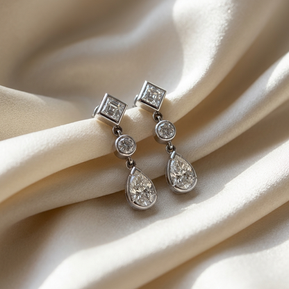 Pear shape and square diamond drop earrings - angled view