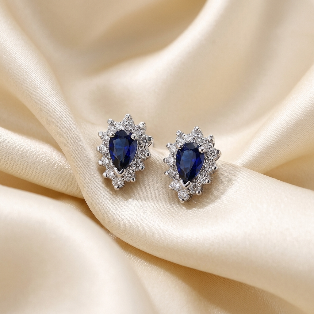 Pear shape sapphire and diamond earrings - detail view