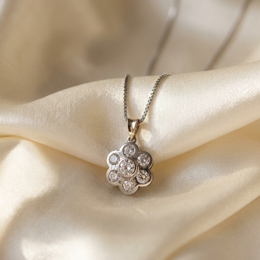 Diamond flower pendant with yellow gold bail