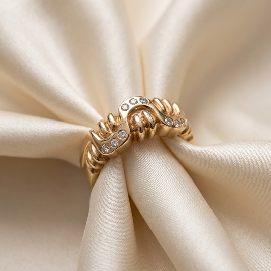 Yellow gold diamond buckle dress ring