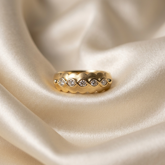 Yellow gold ring with marquise diamond detail