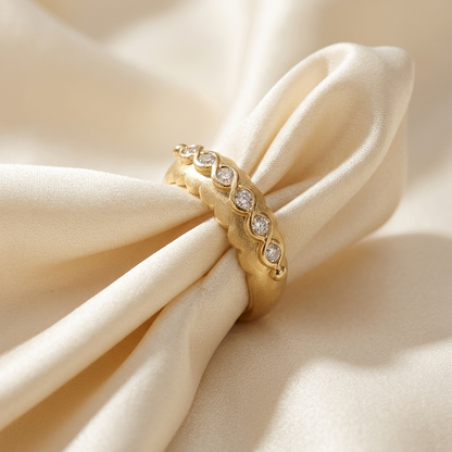 Yellow gold ring with marquise diamond detail - angled view