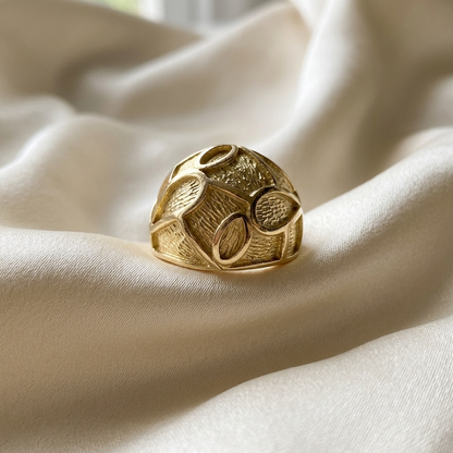 Yellow gold patterned dome ring - angled view