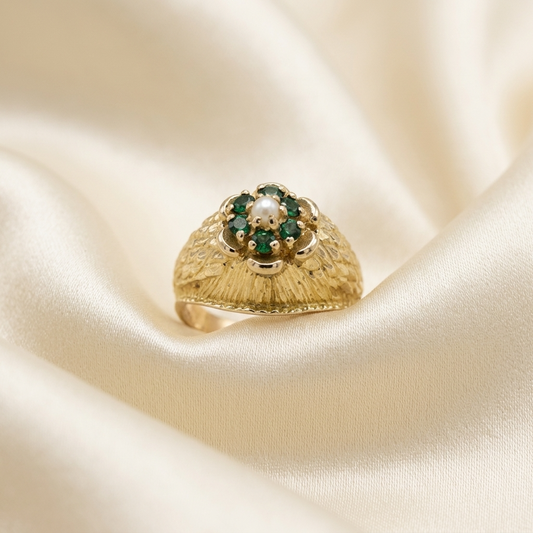 Gold dress ring with emeralds and pearl
