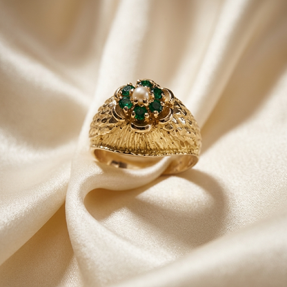 Gold dress ring with emeralds and pearl - angled view