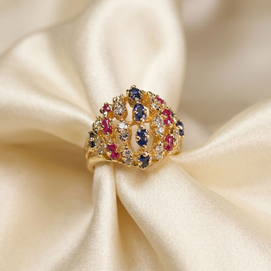Gold domed basket dress ring set with rubies, diamonds and sapphires