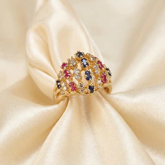 Gold domed basket dress ring set with rubies, diamonds and sapphires