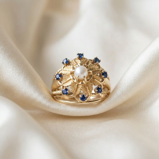 Gold dress ring with sapphires and pearl