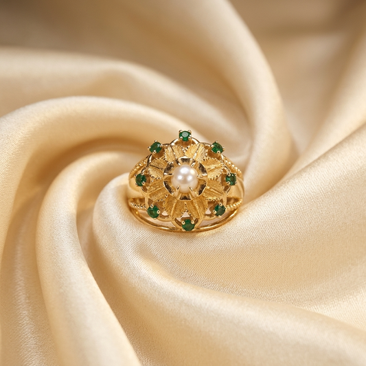 Gold dress ring with emeralds and pearl
