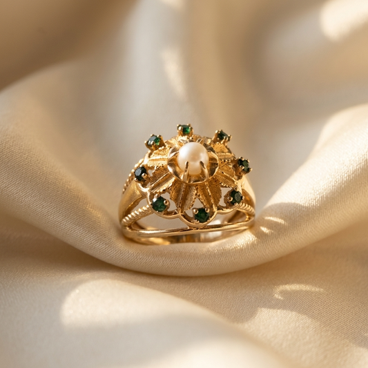 Gold dress ring with emeralds and pearl - side view