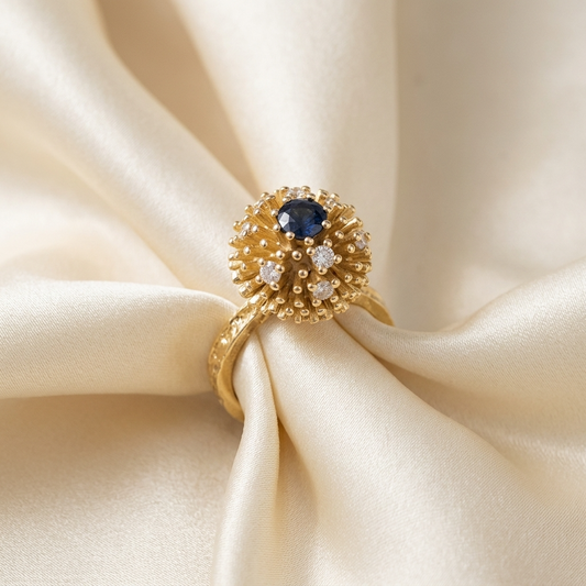 Gold solar burst dress ring with sapphire and diamonds