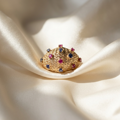 Gold dress ring with rubies and sapphires - angled view