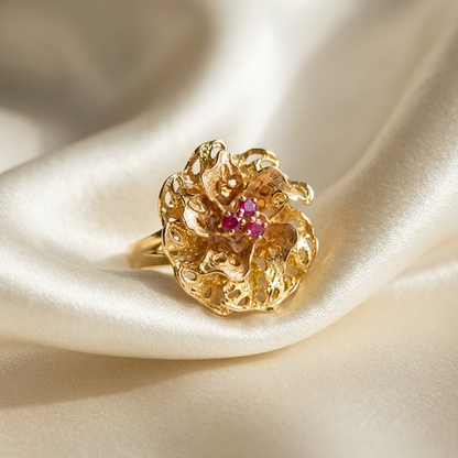 Gold flower dress ring with rubies - angled view