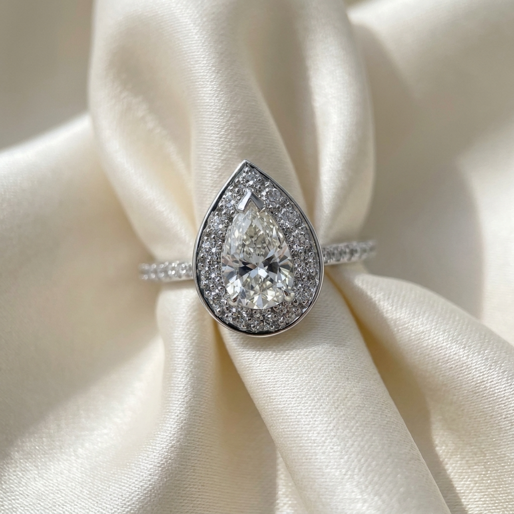 Pear cut diamond halo engagement ring in 18ct white gold — Diamond Imports Australia. © Diamond Imports 2026