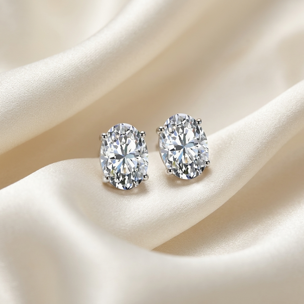 Oval diamond stud earrings in white gold
