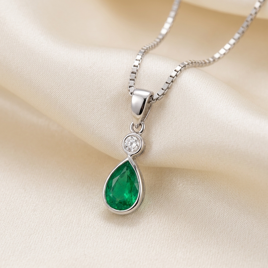 Pear shape bezel set emerald and diamond pendant — handcrafted in Sydney