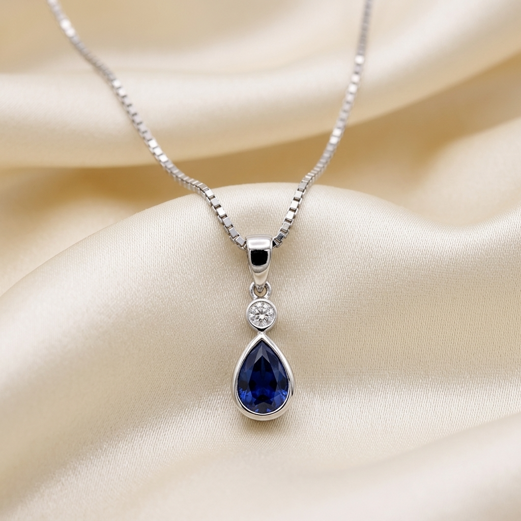 Pear shape bezel set sapphire and diamond pendant — handcrafted in Sydney