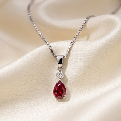 Pear shape ruby and round diamond pendant in white gold — handcrafted in Sydney