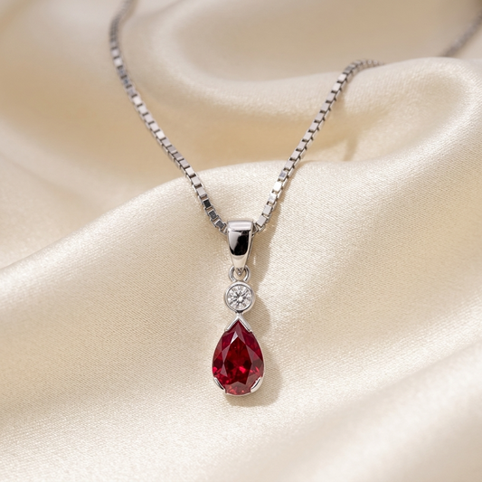 Pear shape ruby and round diamond pendant in white gold — handcrafted in Sydney