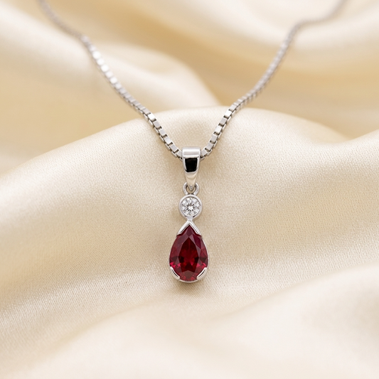 Pear shape ruby and diamond pendant - angled view