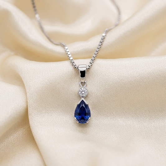Pear shape sapphire and round diamond pendant in white gold — handcrafted in Sydney
