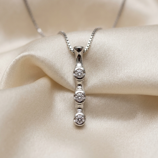 Trilogy bezel set diamond pendant