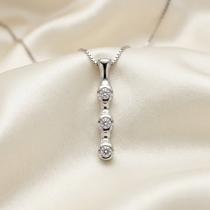 Trilogy bezel set diamond pendant - angled view
