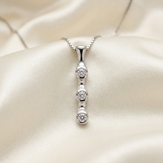 Trilogy bezel set diamond pendant - angled view