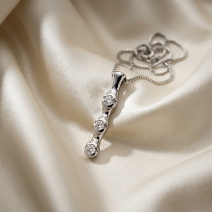 Trilogy bezel set diamond pendant - detail view