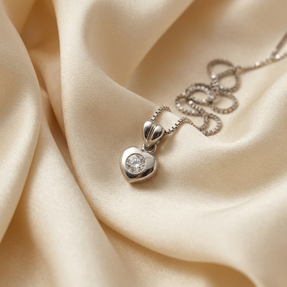 White gold heart shape diamond set pendant - side view