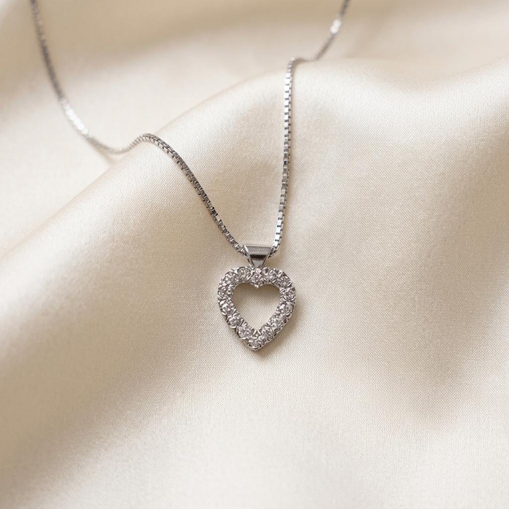 Heart shape diamond pendant claw set with round brilliant diamonds
