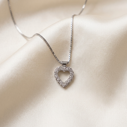 Heart shape diamond pendant claw set with round brilliant diamonds