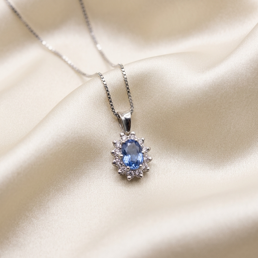 Pear shape Ceylon sapphire and diamond halo pendant