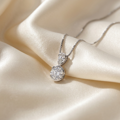 Pear shape and round diamond pendant - side view