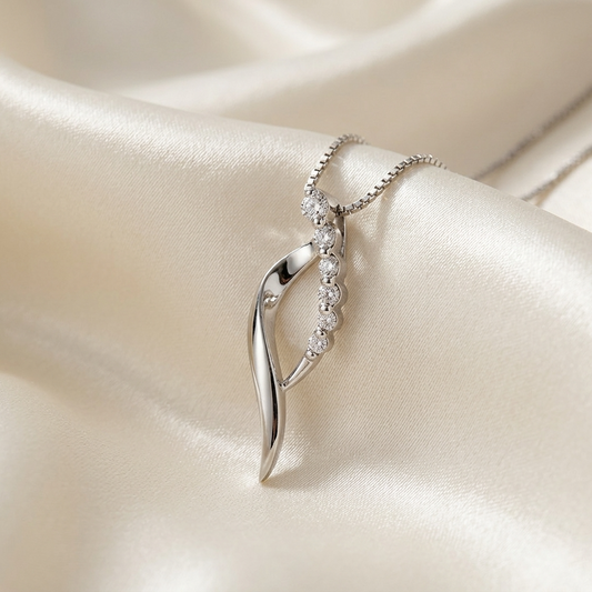 Diamond swirl pendant in white gold