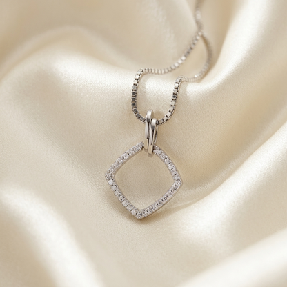 Diamond shape pendant set with round brilliant diamonds in white gold