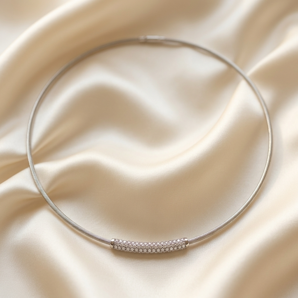 Diamond arc pendant on a white gold cable necklace