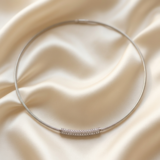 Diamond arc pendant on a white gold cable necklace