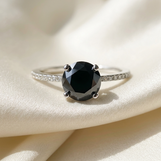 Black diamond solitaire engagement ring with diamond side stones, front view