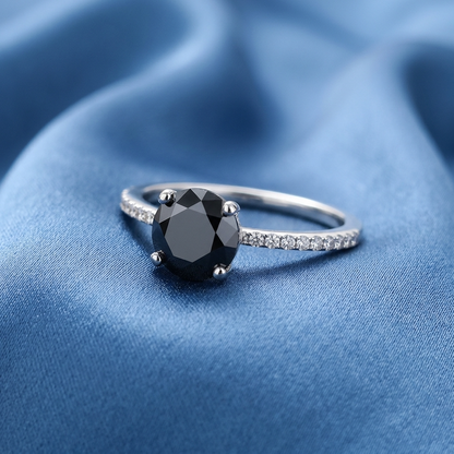 Black diamond solitaire engagement ring with diamond side stones, raised view