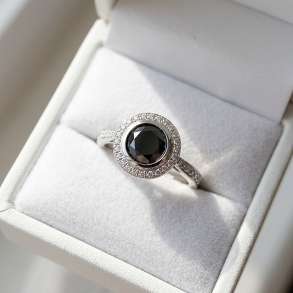 Black diamond bezel set halo engagement ring, front view