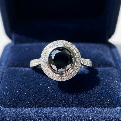 Black diamond bezel set halo engagement ring, three quarter view