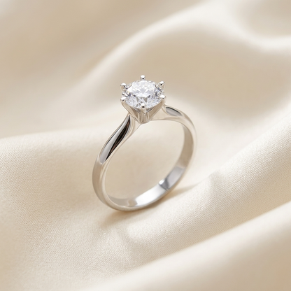 Diana round brilliant diamond solitaire engagement ring, side view showing tapered upswept shank