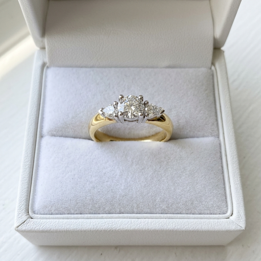 Shayla round brilliant diamond three stone engagement ring with pear shape side stones, front view
