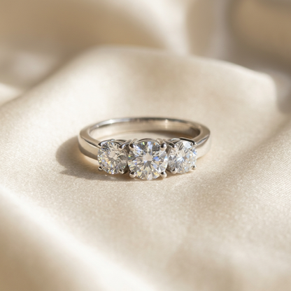 Sascha round brilliant diamond three stone engagement ring, raised view