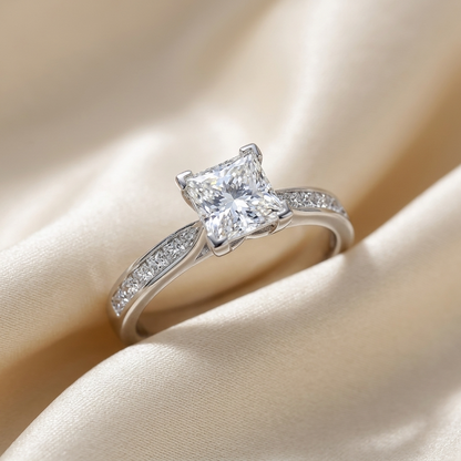 Naomi princess cut diamond engagement ring with diamond side stones, angled view