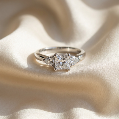 Camille princess cut diamond three stone trilogy ring, angled view