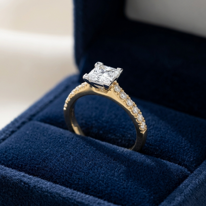 Victoria princess cut diamond engagement ring with diamond set band, three quarter view